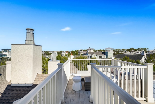 wooden terrace with a residential view