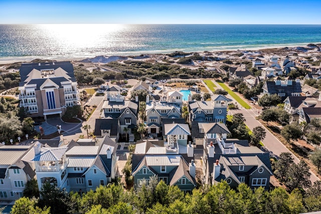 birds eye view of property with a beach view, a residential view, and a water view