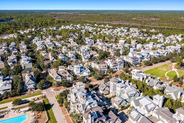 bird's eye view featuring a residential view and a wooded view