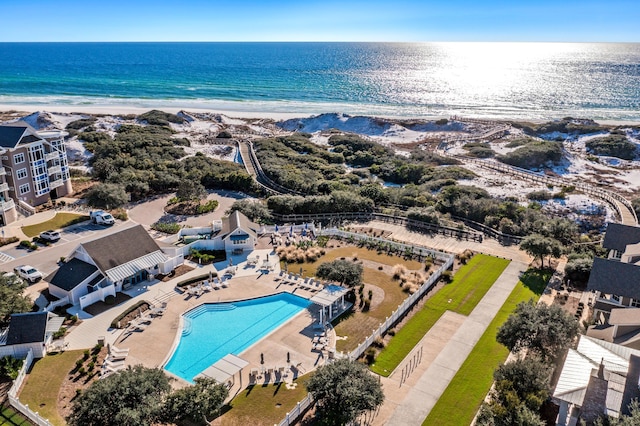 birds eye view of property featuring a view of the beach and a water view