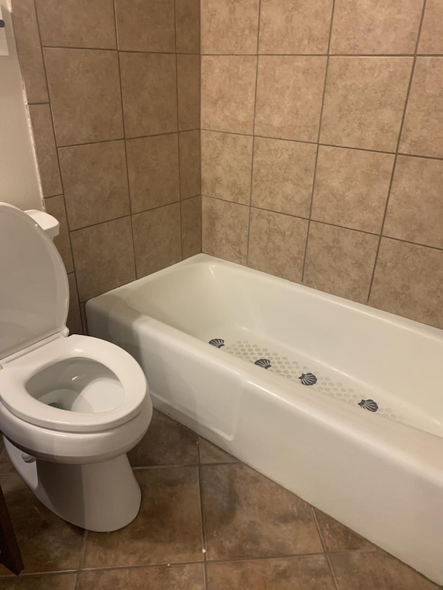 bathroom with tile patterned flooring and toilet