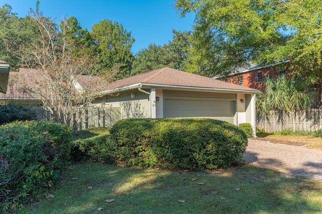 view of property exterior with a yard and a garage