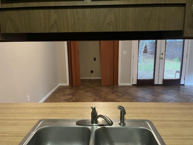 kitchen featuring french doors and sink