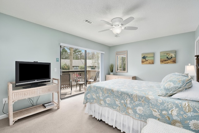 bedroom featuring carpet, a textured ceiling, access to outside, and ceiling fan