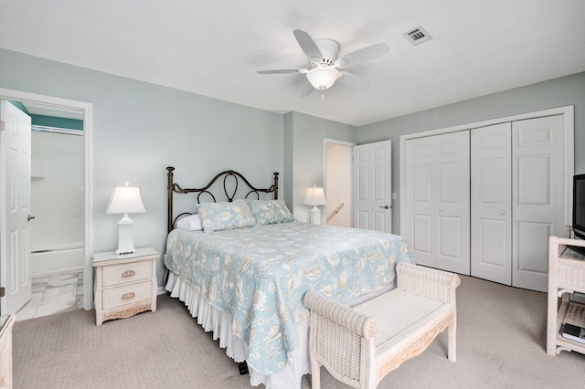 carpeted bedroom featuring ceiling fan and a closet