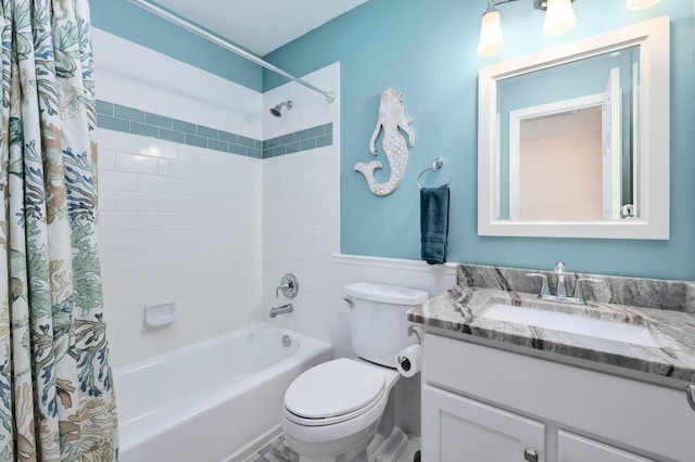 full bathroom with vanity, toilet, and shower / tub combo