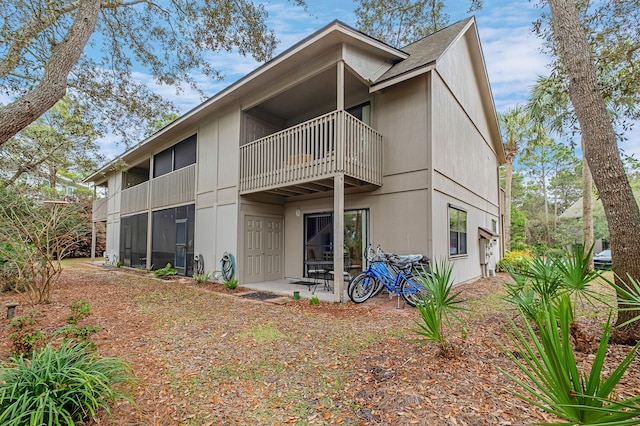 back of property with a patio area