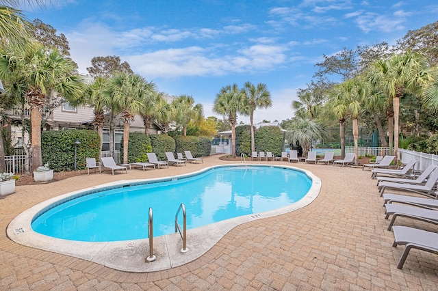 view of swimming pool with a patio area