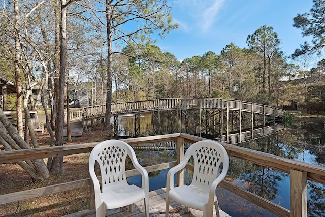 view of patio / terrace featuring a deck with water view