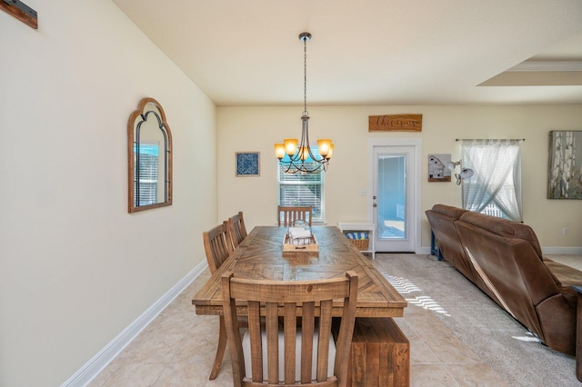 tiled dining room featuring a notable chandelier