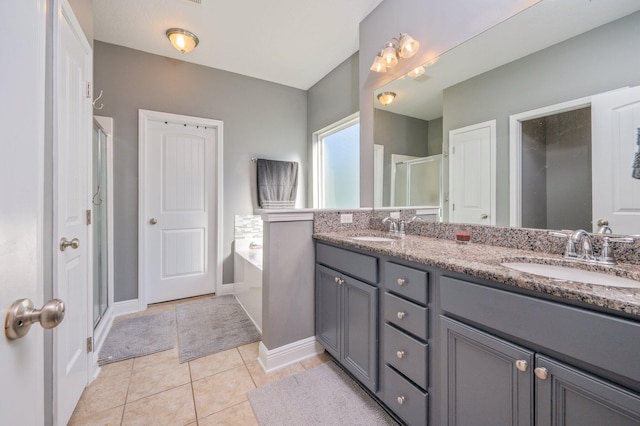 bathroom featuring tile patterned floors, vanity, and independent shower and bath