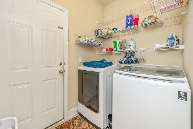 clothes washing area featuring washer and dryer