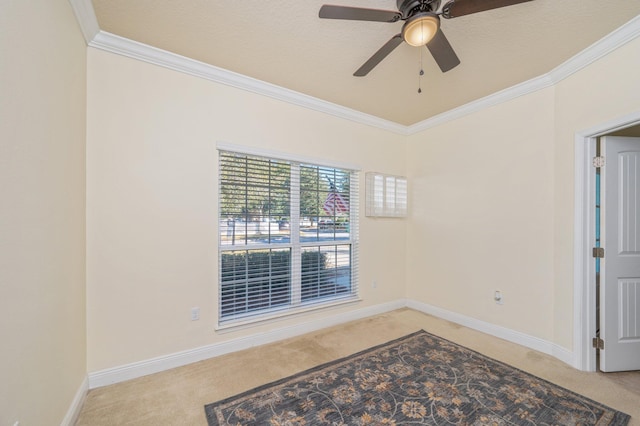 unfurnished room featuring ceiling fan, crown molding, and carpet floors