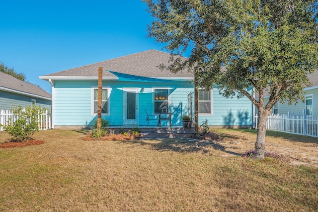 back of house featuring a yard and a porch