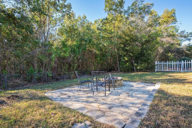 view of patio / terrace with an outdoor fire pit