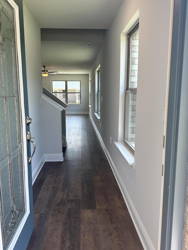 169 Ridgeway Cir, Crestview, FL 32536 - hallway featuring dark wood-style flooring and stairs