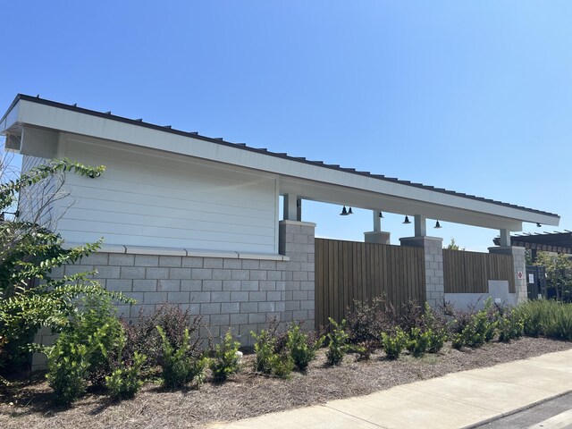 view of property exterior with fence