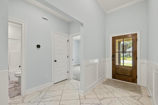 entrance foyer featuring ornamental molding