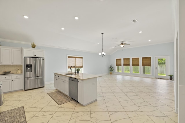 kitchen featuring decorative backsplash, sink, stainless steel appliances, and a wealth of natural light