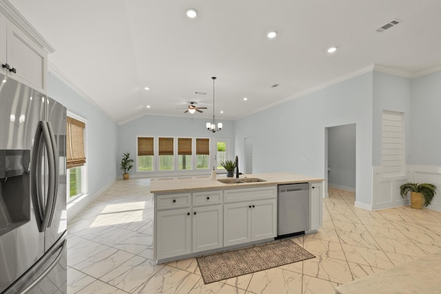 kitchen with pendant lighting, ceiling fan, stainless steel appliances, and a kitchen island with sink