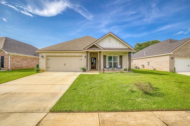 craftsman inspired home with covered porch, a garage, and a front yard