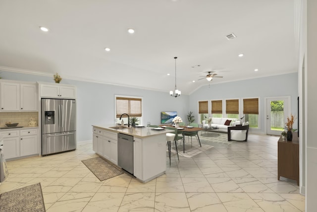 kitchen featuring plenty of natural light, decorative backsplash, sink, and appliances with stainless steel finishes