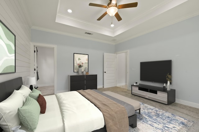 carpeted bedroom with ceiling fan, a raised ceiling, and crown molding