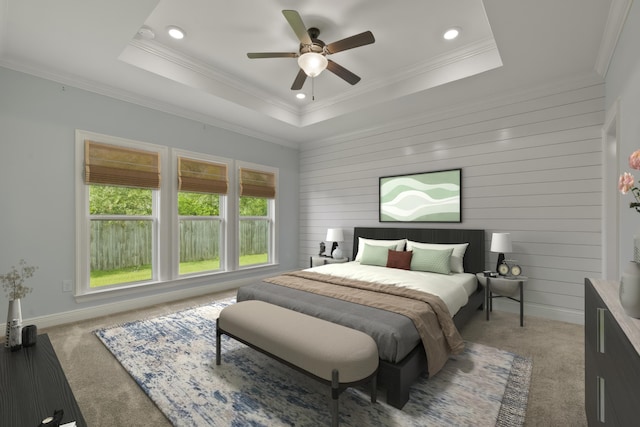 bedroom with carpet flooring, a tray ceiling, ceiling fan, and ornamental molding