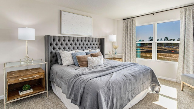 bedroom with carpet floors and baseboards