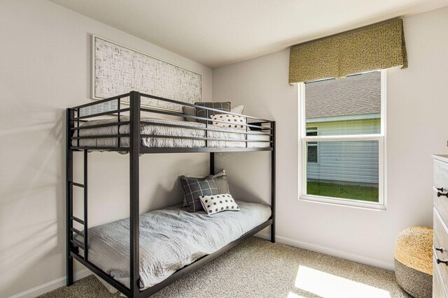 carpeted bedroom with baseboards