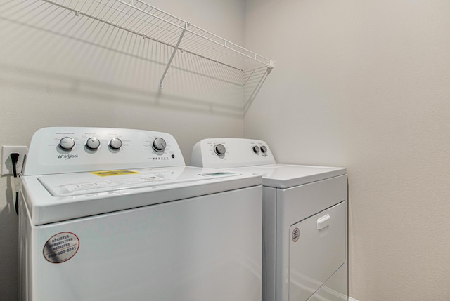 laundry area featuring laundry area and separate washer and dryer