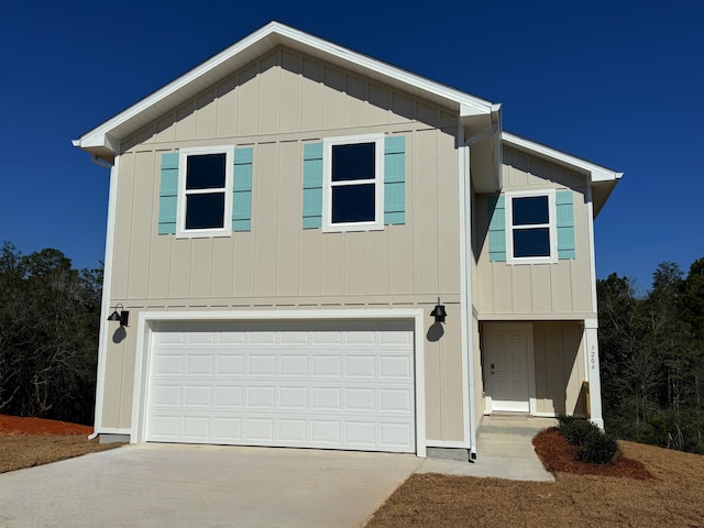 view of front facade with a garage and concrete driveway