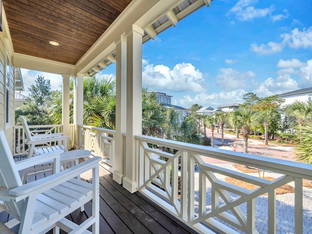 wooden terrace featuring covered porch