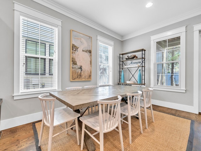 dining room featuring crown molding and wood-type flooring