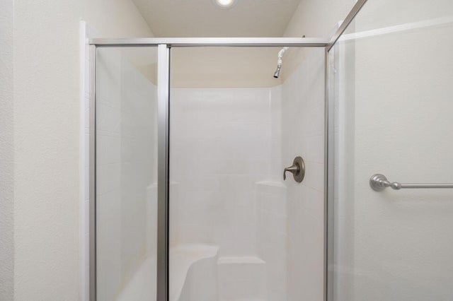 bathroom featuring an enclosed shower