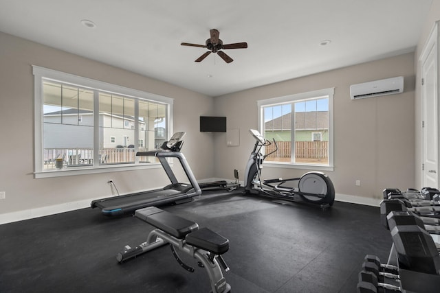 workout area with a wall mounted air conditioner and ceiling fan