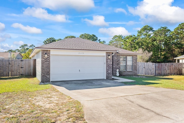 single story home with a garage and a front yard