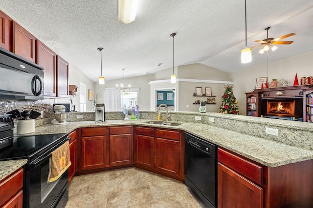 kitchen featuring black appliances, light stone countertops, lofted ceiling, and sink