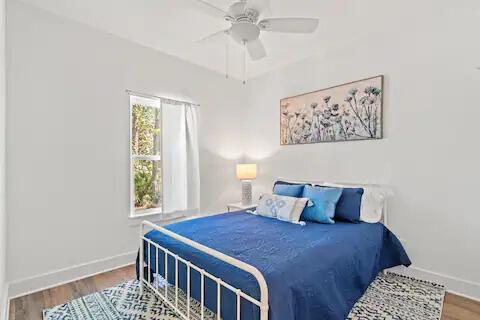 bedroom featuring ceiling fan and hardwood / wood-style floors