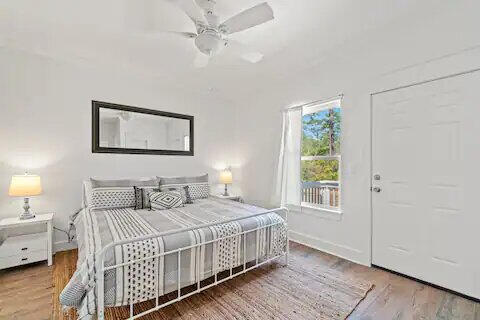 bedroom with wood-type flooring and ceiling fan