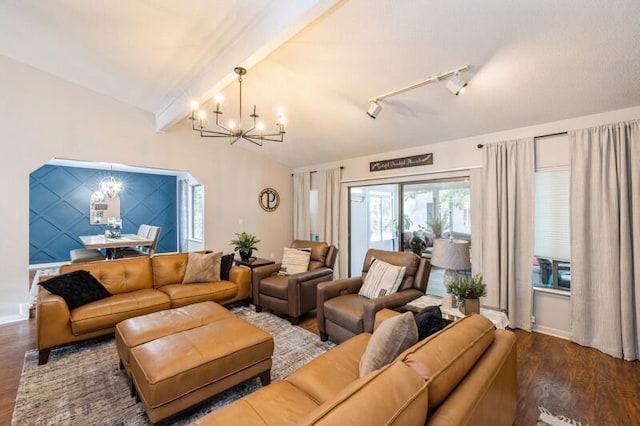 living room featuring beam ceiling, hardwood / wood-style flooring, and an inviting chandelier