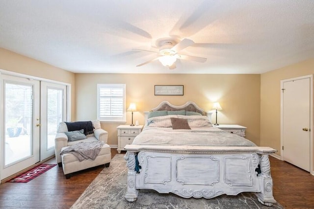 bedroom featuring access to outside, dark hardwood / wood-style flooring, ceiling fan, and french doors