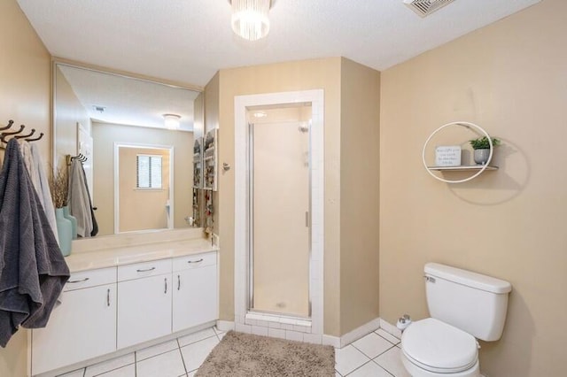 bathroom featuring tile patterned floors, vanity, toilet, and an enclosed shower