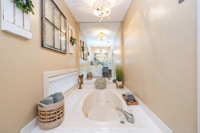 interior space featuring tiled tub and a chandelier