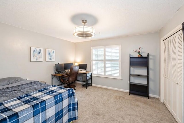 bedroom featuring light carpet and a closet