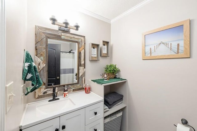 bathroom with curtained shower, crown molding, and vanity