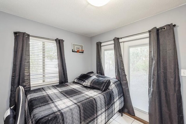 bedroom featuring light tile patterned floors