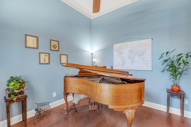 miscellaneous room featuring hardwood / wood-style flooring and crown molding