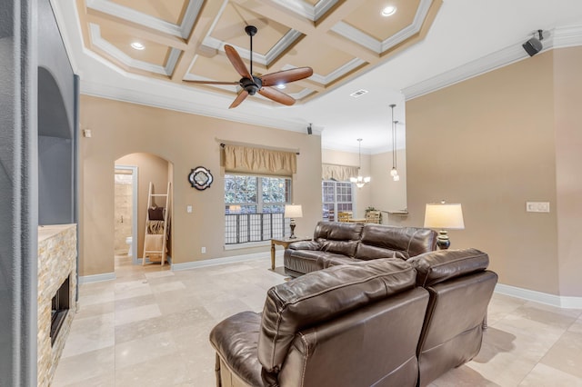 tiled living room with beam ceiling, ceiling fan with notable chandelier, ornamental molding, and coffered ceiling