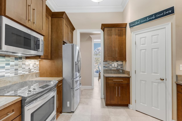 kitchen featuring decorative backsplash, light stone counters, stainless steel appliances, crown molding, and light tile patterned floors